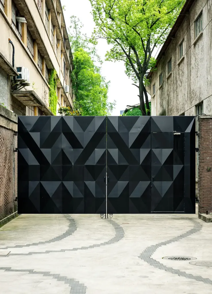 Modern black steel gate at a property entrance