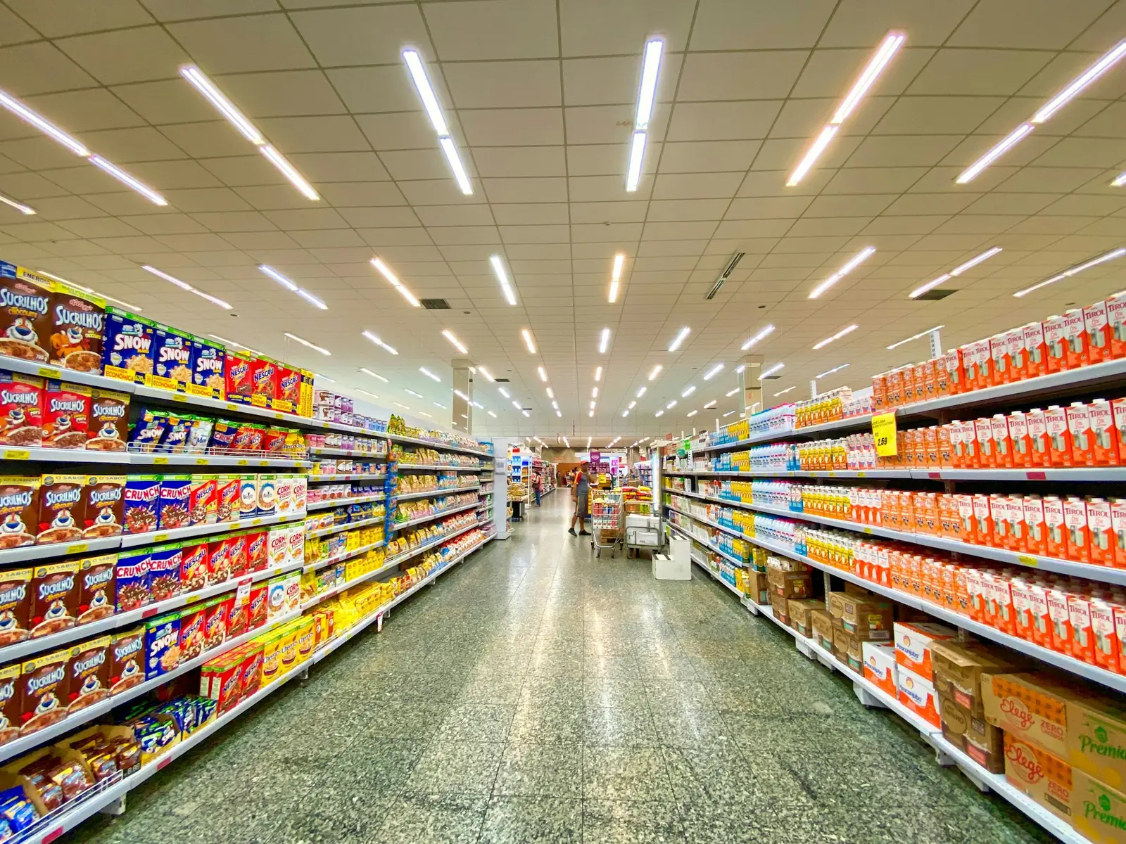 Supermarket aisle with stocked shelves
