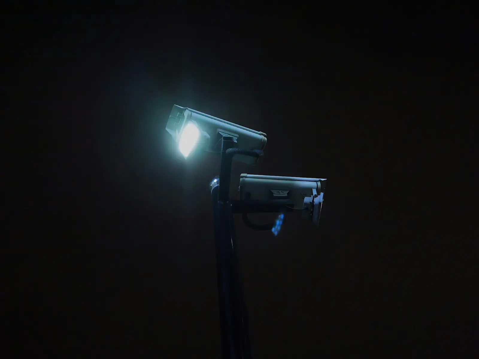 Security light and camera illuminating a property at night